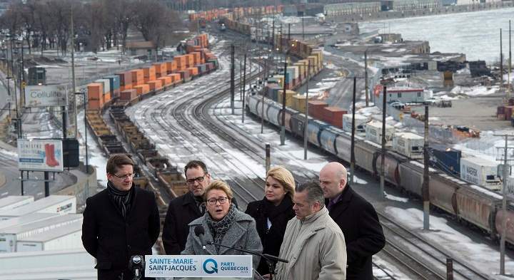PQ Leader Pauline Marois holds a news conference on the rooftop of a building Wednesday, April 2, 2014 in Montreal.