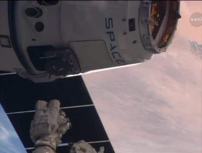 This frame grabbed image from NASA-TV Sunday April 20, 2014 shows the SpaceX Dragon resupply capsule just prior to being captured by the Canadarm2 from the International Space Station at 7:14 a.m. EDT Sunday.