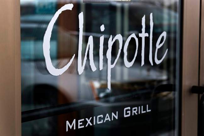 This Tuesday, Jan. 28, 2014, file photo, shows the door at a Chipotle Mexican Grill in Robinson Township, Pa. 