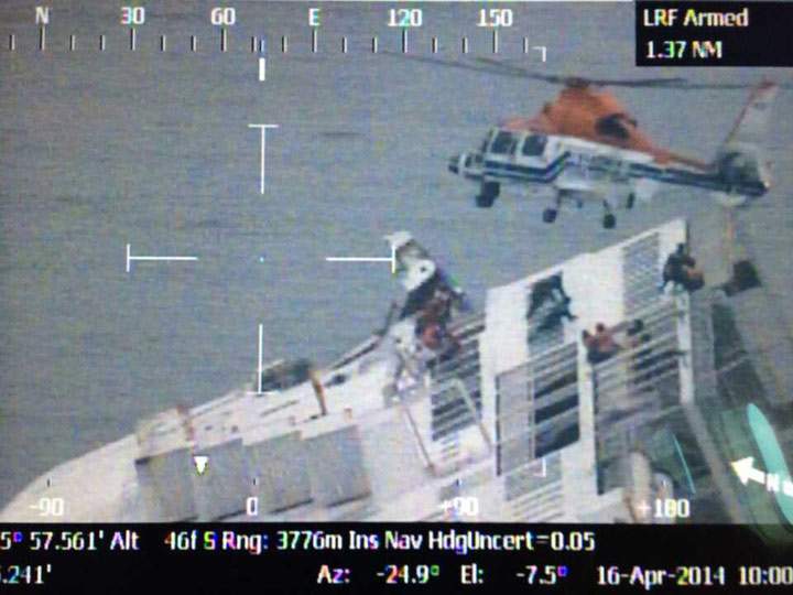 In this handout image provided by the Republic of Korea Coast Guard, rescue work by members of the Republic of Korea Coast Guard continues around the ferry sinking off the coast of Jindo Island on April 16, 2014 in Jindo-gun, South Korea.