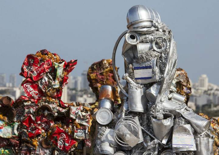 Hundreds of human-size figures constructed from 20 tons of recycled material, including iron, glass, computer parts, cans and more, are on display in Ariel Sharon Park until Apr. 26.