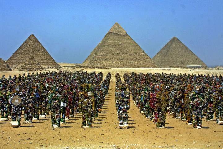 HA Schult's "Trash People" stand in front of the Pyramids of Giza.