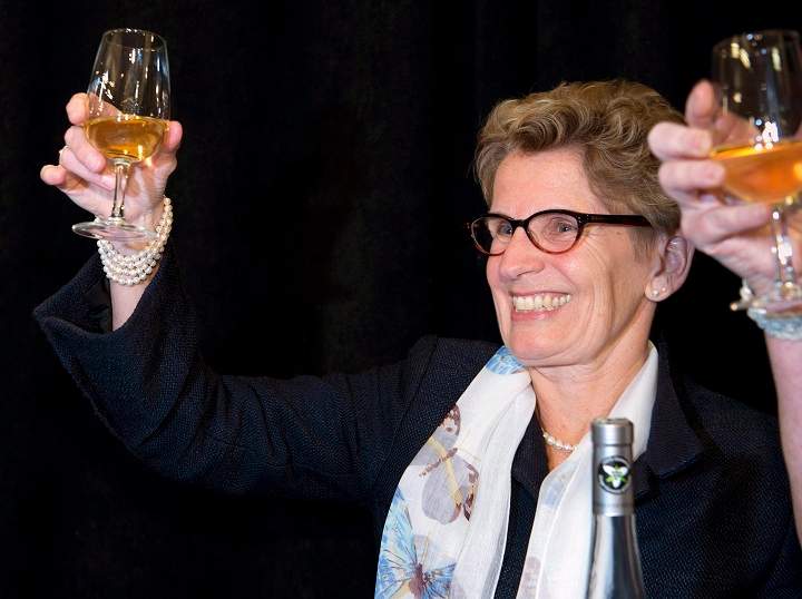 Ontario Premier Kathleen Wynne celebrates the grape harvest by toasting with Ontario Ice Wine at an event in an LCBO in Toronto on Wednesday January 15, 2014. 
