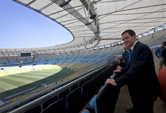 Britain's Chancellor of the Exchequer George Osborne visits the Maracana stadium in Rio de Janeiro, Brazil, Monday, April 7, 2014. The city of Rio de Janeiro will host the Olympics in 2016. (AP Photo/Silvia Izquierdo)