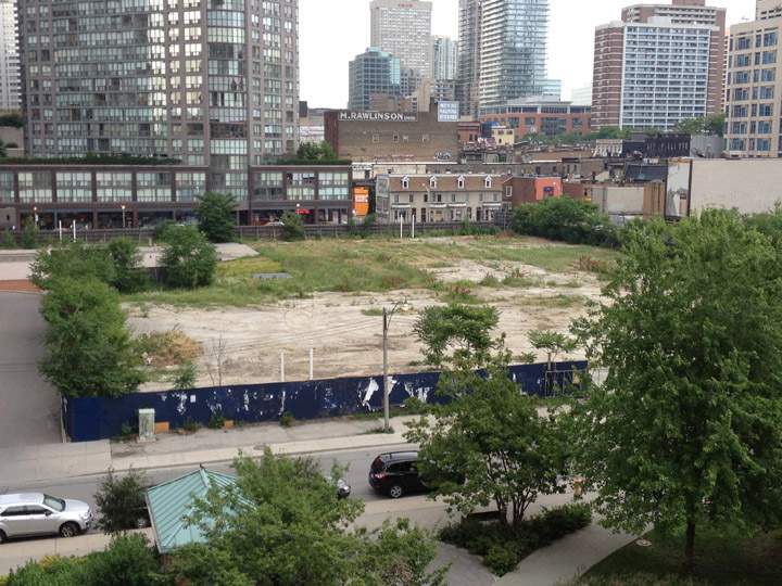 A plot of land sits empty at 11 Wellesley in Toronto.