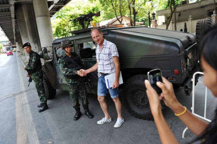 How is martial law affecting tourism in Thailand?