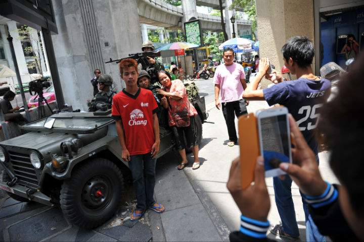 How is martial law affecting tourism in Thailand?