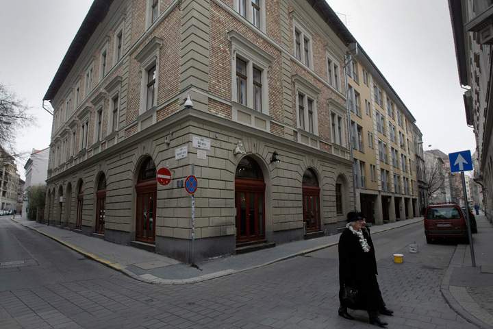 An older couple crosses Dob street, the former Ghetto and home of 40,000 Jews during WWII in Budapest, Hungary on January 27, 2013, the International Holocaust Memorial Day to commemorate the victims of the Nazi regime.
