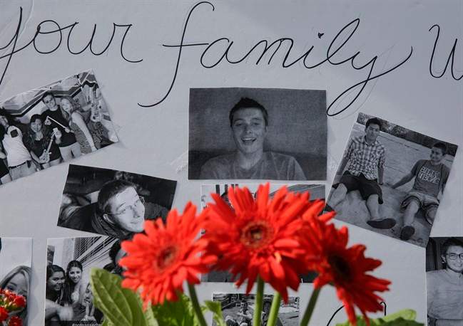 Images of Christopher Martinez are displayed as part of a memorial in front of the IV Deli Mart, where part of Friday night's mass shooting took place, on Sunday, May 25, 2014, in the Isla Vista beach community of Santa Barbara, Calif. 