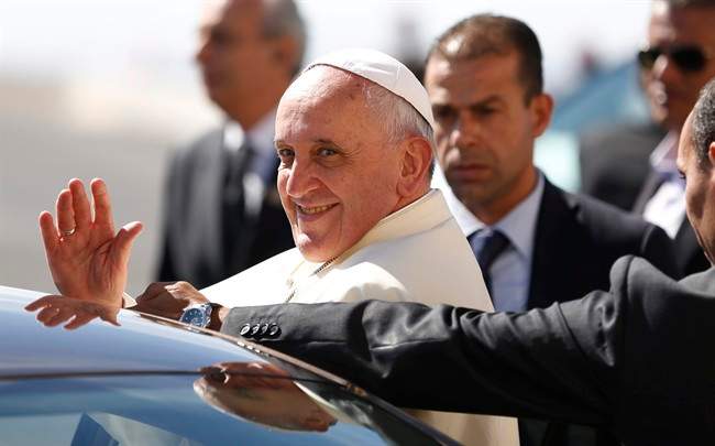 Pope Francis waves upon his arrival at the West Bank town of Bethlehem on Sunday, May 25, 2014.