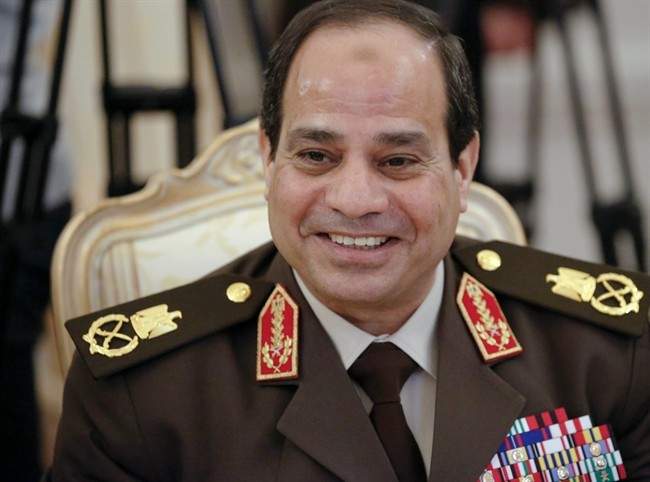 FILE - In this Thursday, Feb. 13, 2014 file photo, Egypt’s Abdel-Fattah el-Sissi smiles as he speaks to Russian Foreign Minister Sergey Lavrov during their talks in Moscow, Russia. 