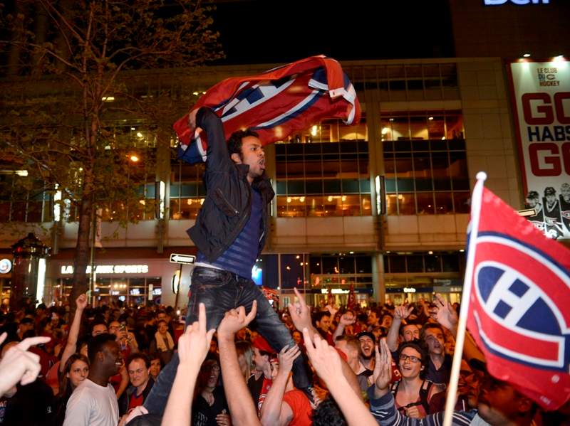 Montreal Canadiens fans celebrate their team’s NHL playoff win over the Boston Bruins in Montreal Wednesday May 14, 2014. THE CANADIAN PRESS/Ryan Remiorz