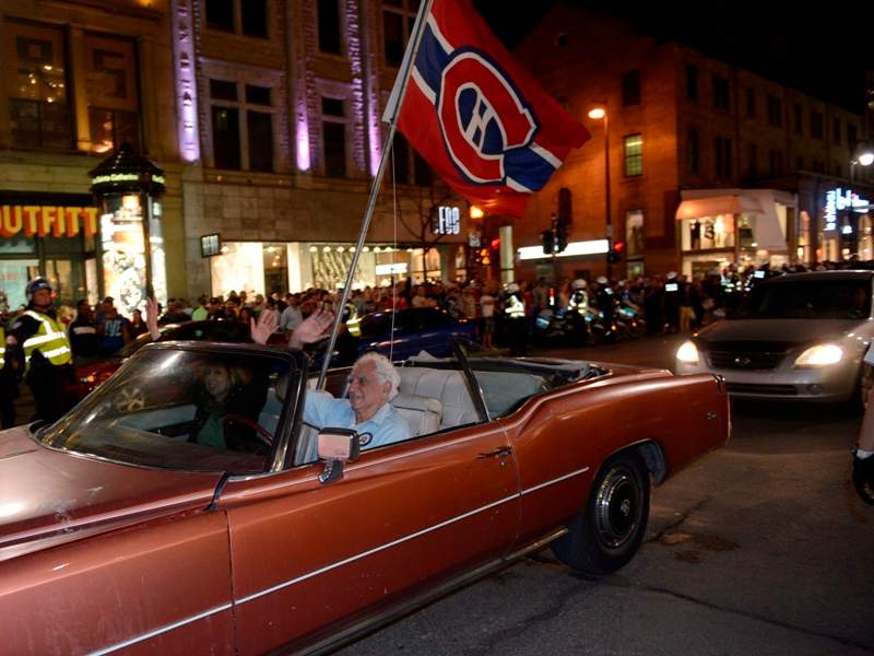 Montreal Canadiens fans celebrate their team’s NHL playoff win over the Boston Bruins in Montreal Wednesday May 14, 2014. THE CANADIAN PRESS/Ryan Remiorz