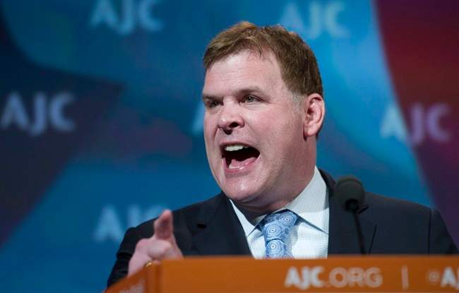 Canadian Foreign Minister John Baird gestures as he addresses the American Jewish Committee (AJC) Global Forum closing plenary in Washington, Wednesday, May 14, 2014. (AP Photo/Cliff Owen).
