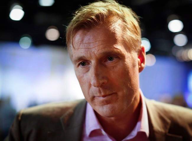 Maxime Bernier, Minister of State for Small Business and Tourism, speaks to reporters at the Conservative convention in Calgary, Saturday, Nov. 2, 2013.