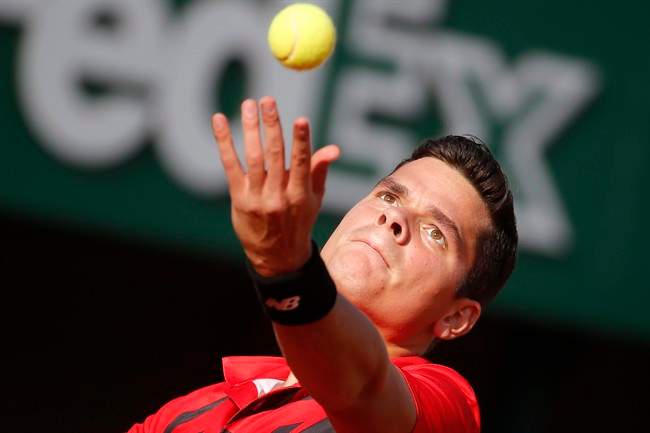 Canada's Milos Raonic serves in Paris, Friday, May 30, 2014.