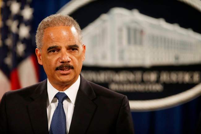 Attorney General Eric Holder speaks at a news conference at the Justice Department in Washington.