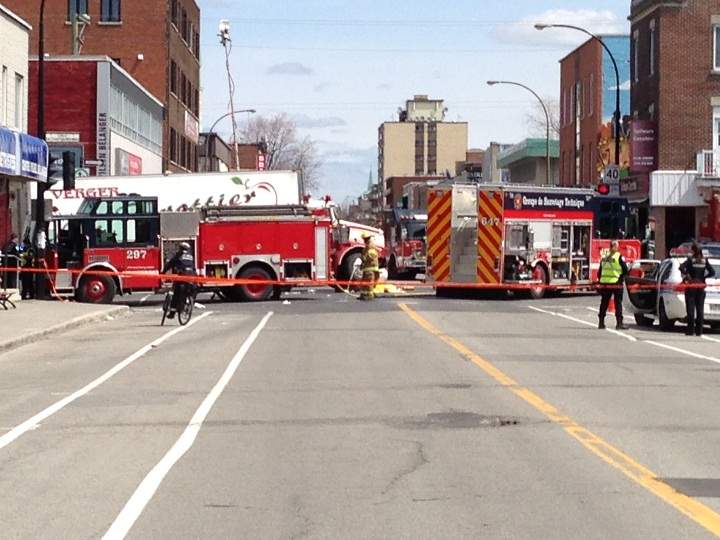Emergency crews worked to save the lives of two pedestrians struck by a semi-trailer truck in Montreal on May 6, 2014.