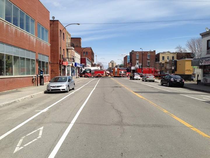 Firefighters worked hard to save the lives of two pedestrians trapped under a semi-trailer truck in Montreal on May 6, 2014.