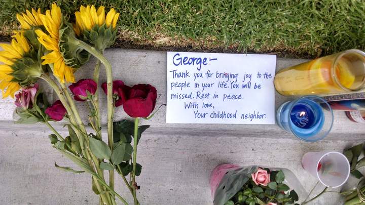 A note addressed to George Chen, 20, of San Jose, Calif., one of three men found stabbed to death in the apartment of Elliott Rodger, is seen outside the apartment where he lived in the Isla Vista neighborhood of Goleta, Calif., Monday, May 26, 2014.
