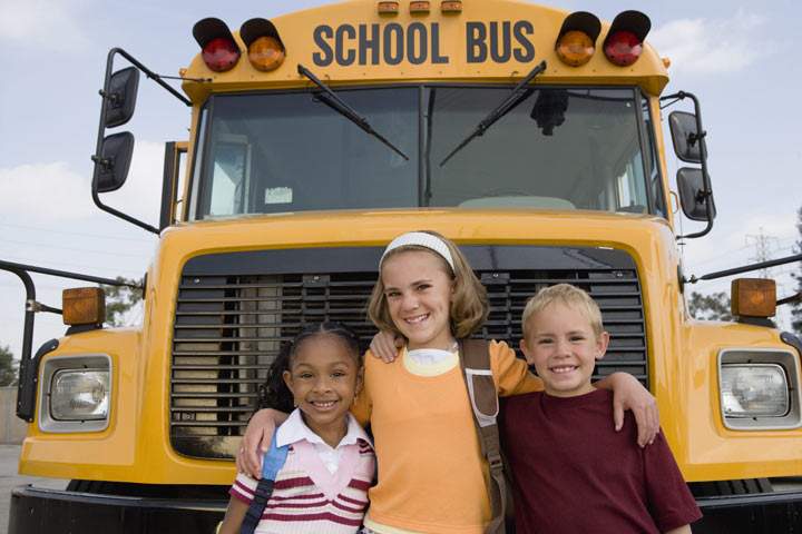Not all kids are as happy as the three elementary students above after a bus ride.