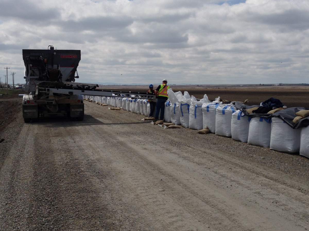 A temporary dyke that is being built on the southwest end of High River.
