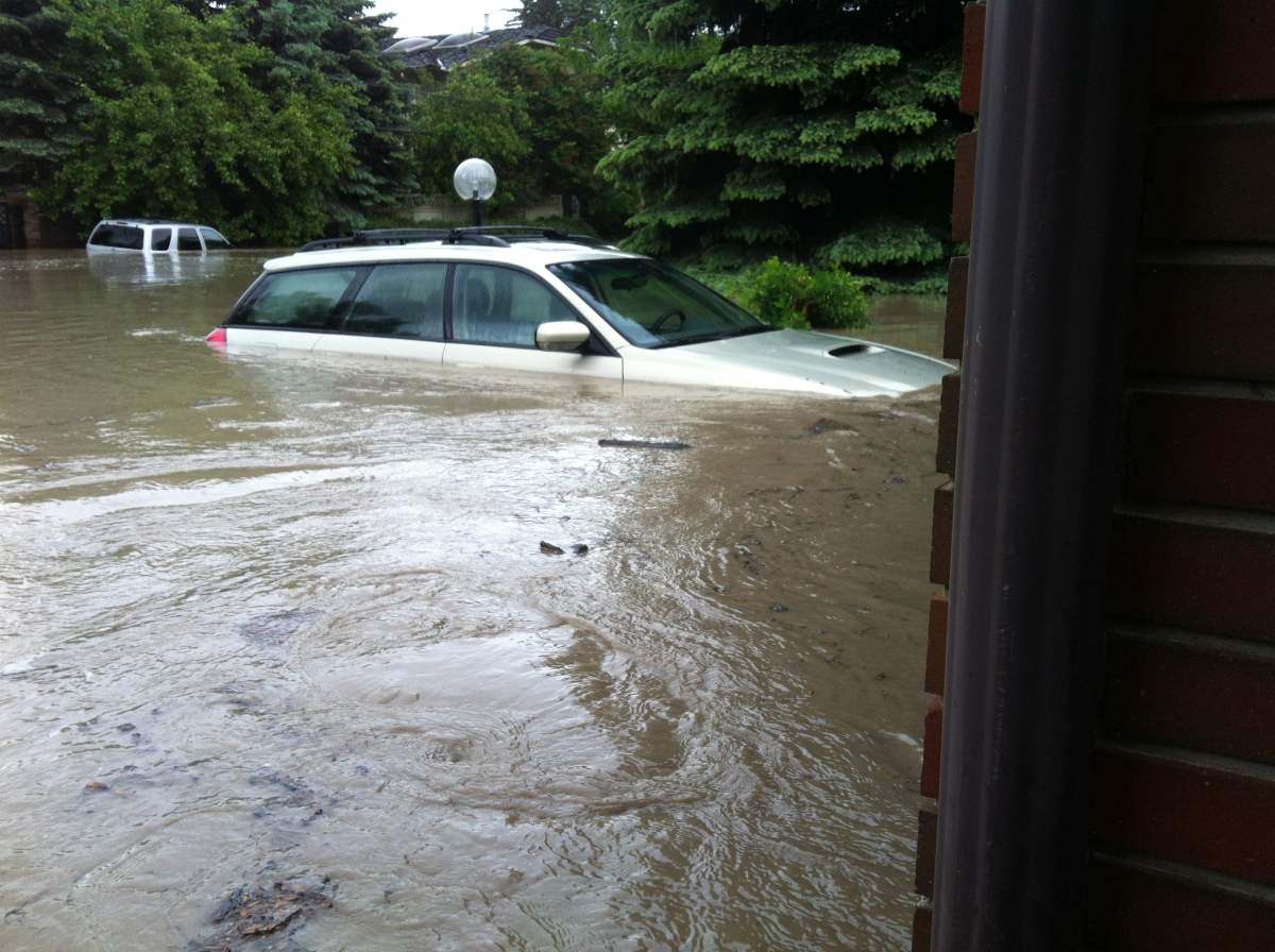 Darcy Verhun’s vehicle sits partially submerged in the driveway of his Rideau Park home.