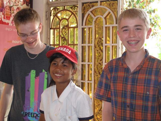 Brubacher children stand with their sponsored child.  Brubacher children stand with their sponsored child. 
