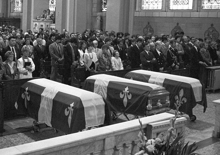 The coffins carrying the bodies of the three National Assembly employess who were killed in the shooting spree May 8, 1984, lie in front of their families during a church service May 11, 1984, in Quebec City.