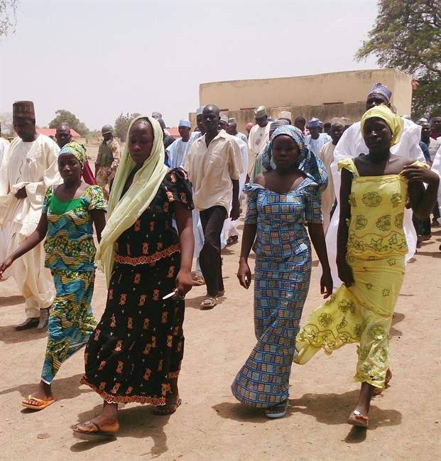  In this Monday April 21, 2014 file photo, four female students of government secondary school Chibok, who were abducted by gunmen and reunited with their families walk in Chibok, Nigeria. The number of kidnapped schoolgirls missing in Nigeria has risen to 276, up by more than 30 from a previous estimate, police said, adding that the actual number abducted by Islamic extremists on April 14 was more than 300. Police Commissioner Tanko Lawan said the number of girls and young women who have escaped also has risen, to 53.
