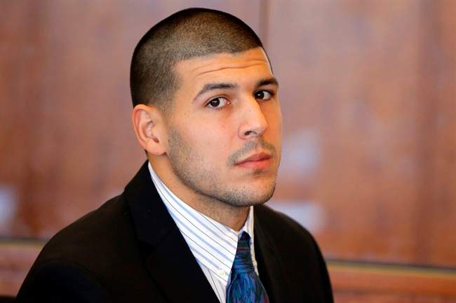 In this Oct. 9, 2013 file photo, former New England Patriots NFL football player Aaron Hernandez attends a pre-trial court hearing in Fall River, Mass. 