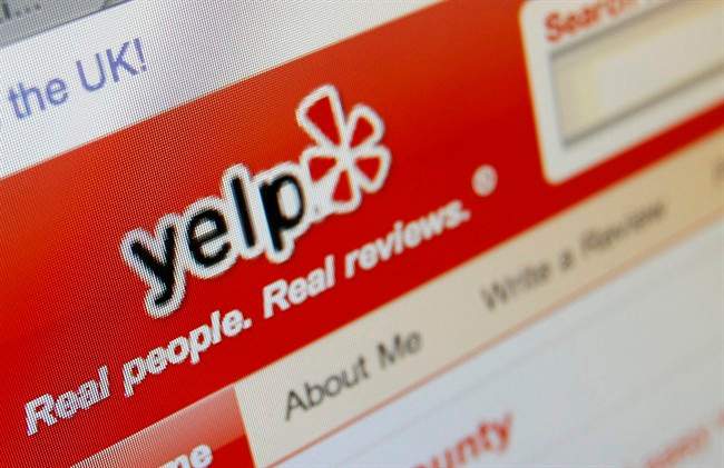 FILE - This March 17, 2010 file photo shows the Yelp website on a computer screen in Los Angeles.