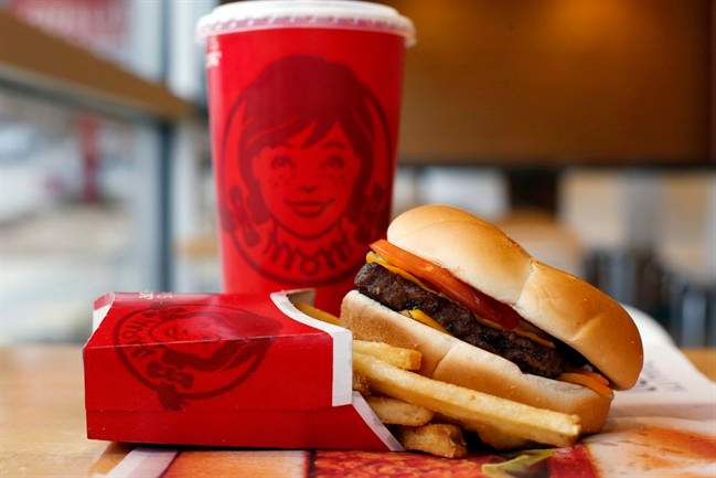 This March 17, 2014 photo shows a Wendy's single hamburger with cheese combo meal at a Wendy's restaurant in Pittsburgh.