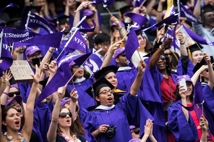 Students celebrate at the commencement of the 2014 New York University graduation ceremony at Yankee Stadium on May 21, 2014 in the Bronx borough of New York City. 