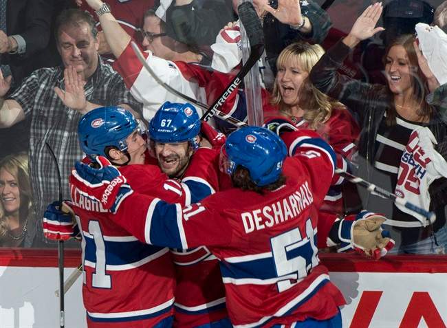 Montreal Canadiens players and fans celebrate a winning goal.