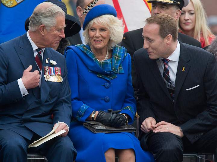 Prince Charles and his wife Camilla, the Duchess of Cornwall, chat with Justice Minister Peter MacKay at the Grand Parade in Halifax, Nova Scotia, on Monday, May 19, 2014. The couple is on a four-day tour of Canada.
