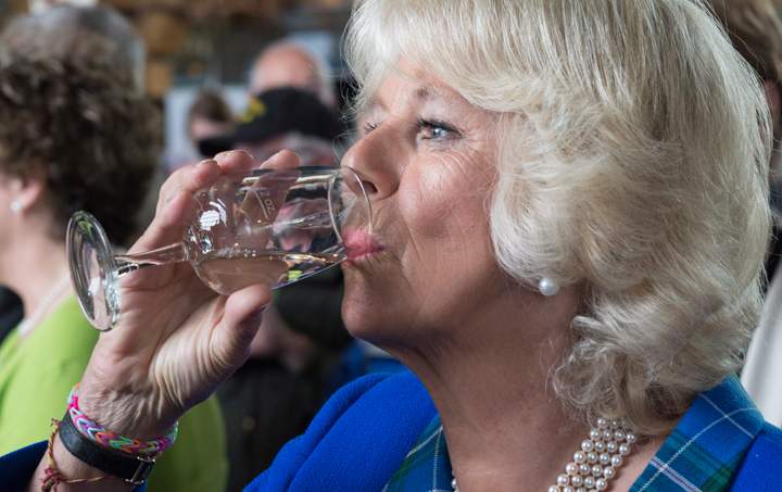 Camilla, the Duchess of Cornwall, tastes wine while touring a farmer’s market Monday, May 19, 2014 in Halifax. The Royal couple are on a four-day tour of Canada.