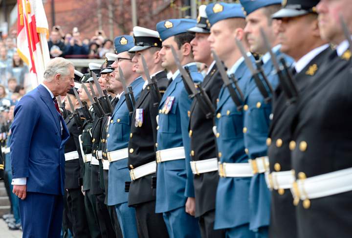 Prince Charles inspects honour guards in Halifax on Monday, May 19, 2014.