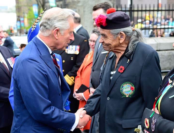 Prince Charles is greeted by Shubenacadie First Nation Elder Doug Knockwood in Halifax on Monday, May 19, 2014. THE CANADIAN PRESS/Paul Chiasson