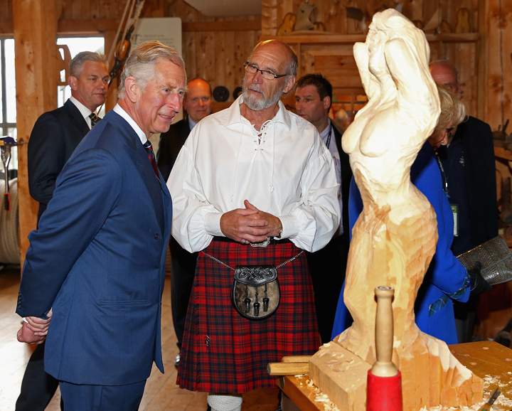 Prince Charles, Prince of Wales and Camilla, Duchess of Cornwall look at a sculpture as they visit Pier 21 on May 19, 2014 in Halifax, Canada.