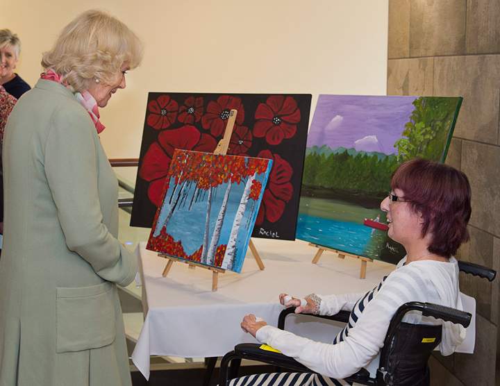 Camilla, the Duchess of Cornwall, chats with resident artist Rachel Borland, as she visits Prince Edward Home, a long-term care facility for seniors, in Charlottetown, Prince Edward Island, on Tuesday, May 20, 2014.