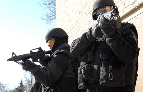 Officers said three prohibited firearms, ammunition and evidence related to other property-related offences were found.
