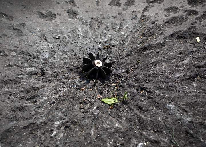 A part of the mortar shell seen at a checkpoint near Slovyansk, eastern Ukraine, Thursday, May 15, 2014. The Organization for Security and Cooperation in Europe, a trans-Atlantic security group, put forward a "road map" calling for national dialogue as a first step toward resolving the escalating tensions. 