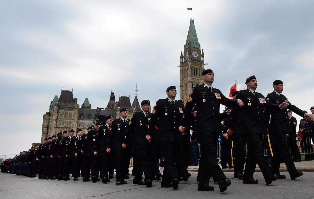 Canadian Forces members parade from Parliament Hill during the National Day of Honour in Ottawa on Friday, May 9, 2014. THE CANADIAN PRESS/Sean Kilpatrick.