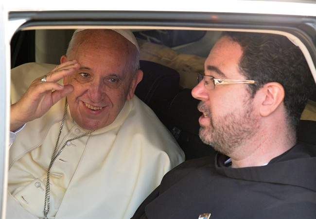 Pope Francis waves from a car as he leaves after praying at the Western Wall in Jerusalem's Old City, Israel, Monday, May 26, 2014.