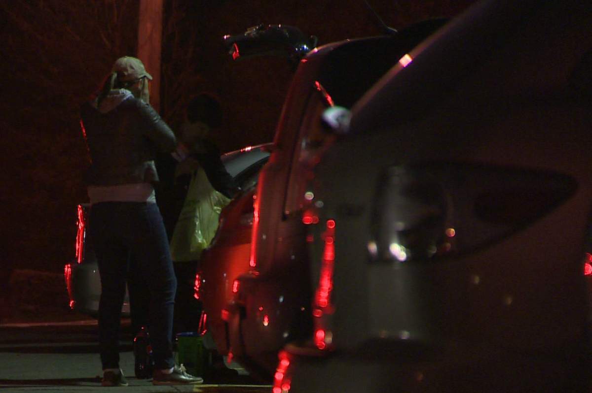 Residents of a Dartmouth apartment building pack up belongings they salvaged after a fire.