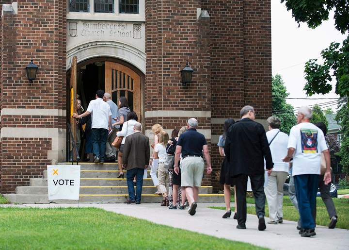 Voters flock to a poll in Toronto's west end, June 12, 2014.