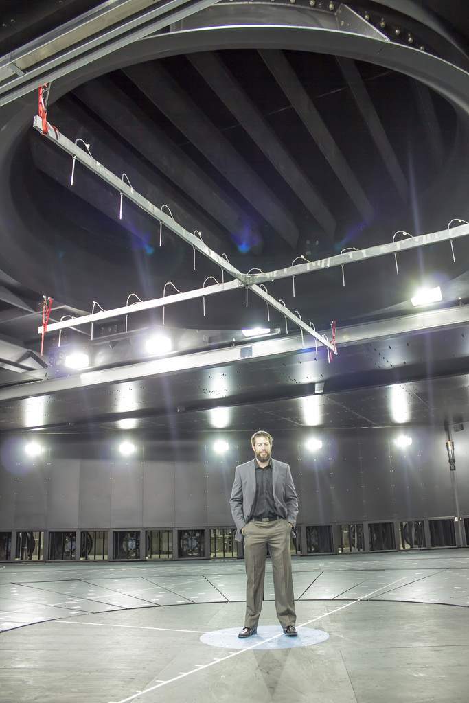 WindEEE operations manager Andrew Mathers stands below the massive fan at the facility.