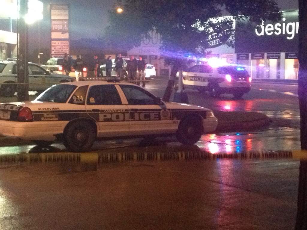 Police block off a Domo gas bar in Osborne Village on Thursday evening.