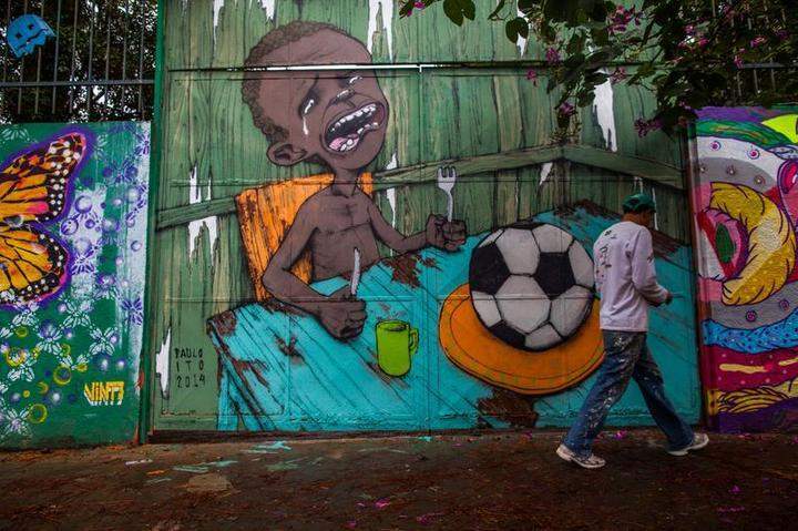 SAO PAULO, BRAZIL - MAY 24: Graffiti on a wall of a public school criticizes the hosting of the World Cup on May 24, 2014 in Sao Paulo, Brazil. Members of Anarchist Black Bloc protested against President Dilma Rousseff and corruption in the country. Demonstrators chanted ''will not get Cup!'' during the protests and later burned the Brazilian flag along with the official sticker album of the World Cup.